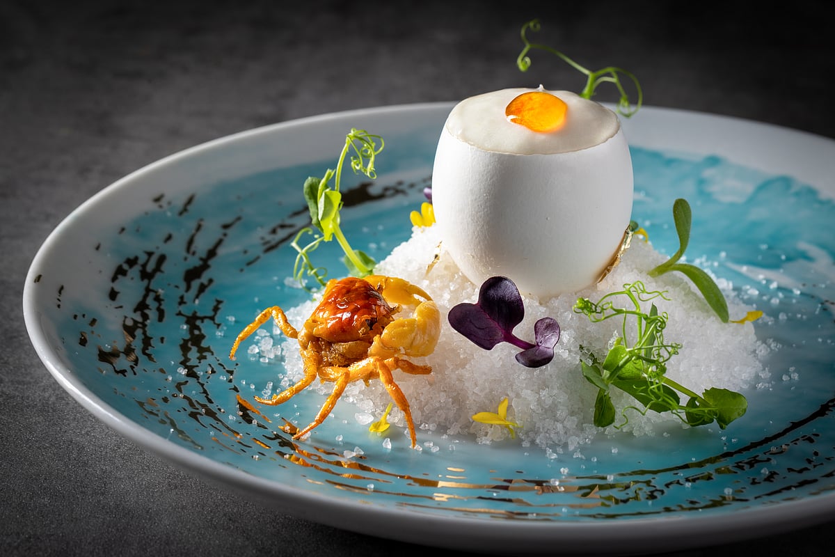 Layers of steamed egg white, crab meat with Hua-Diao wine, and lily flower root foam, served in eggshell in Hong Kong Cuisine 1983 - Hong Kong Cuisine 1983